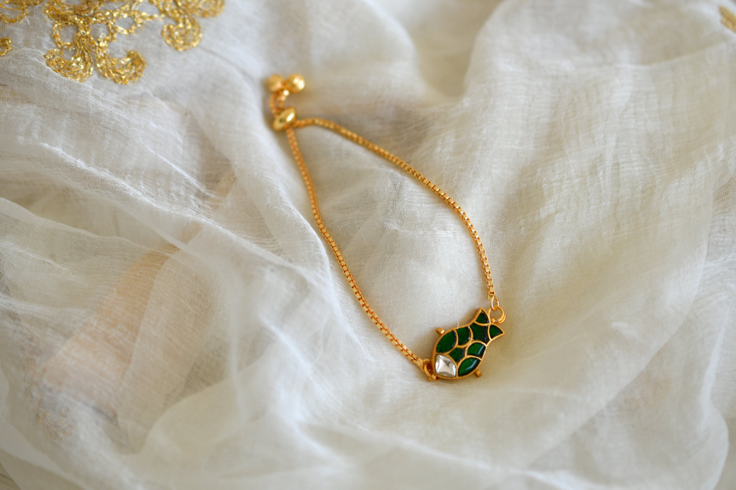 Gold tone green kundan jadau fish bracelet dj-52673