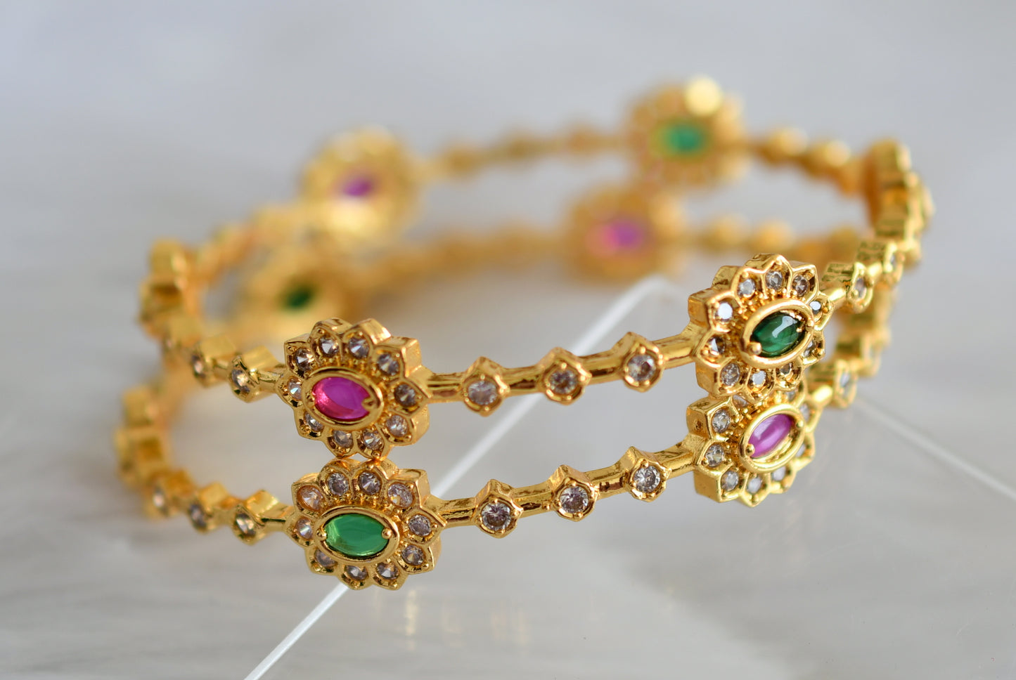 Gold tone pink-green-white bangles(2.8) dj-43900