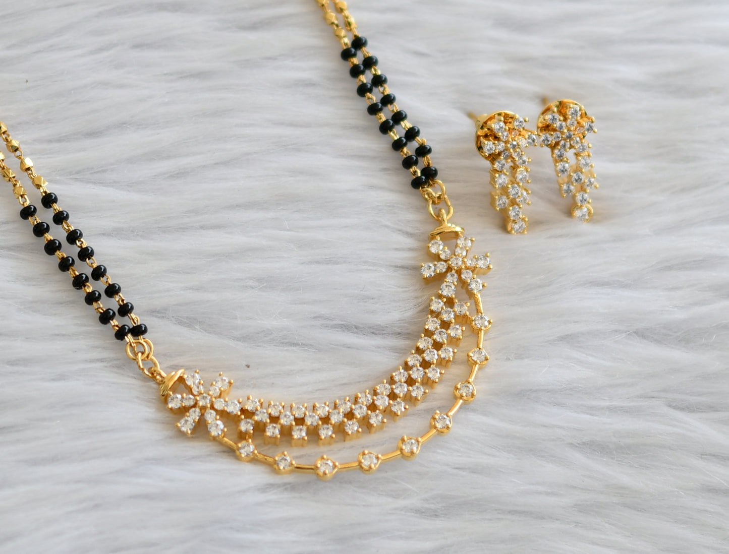 Gold tone 24 inches mangalsutra with cz white flower pendant set dj-45896