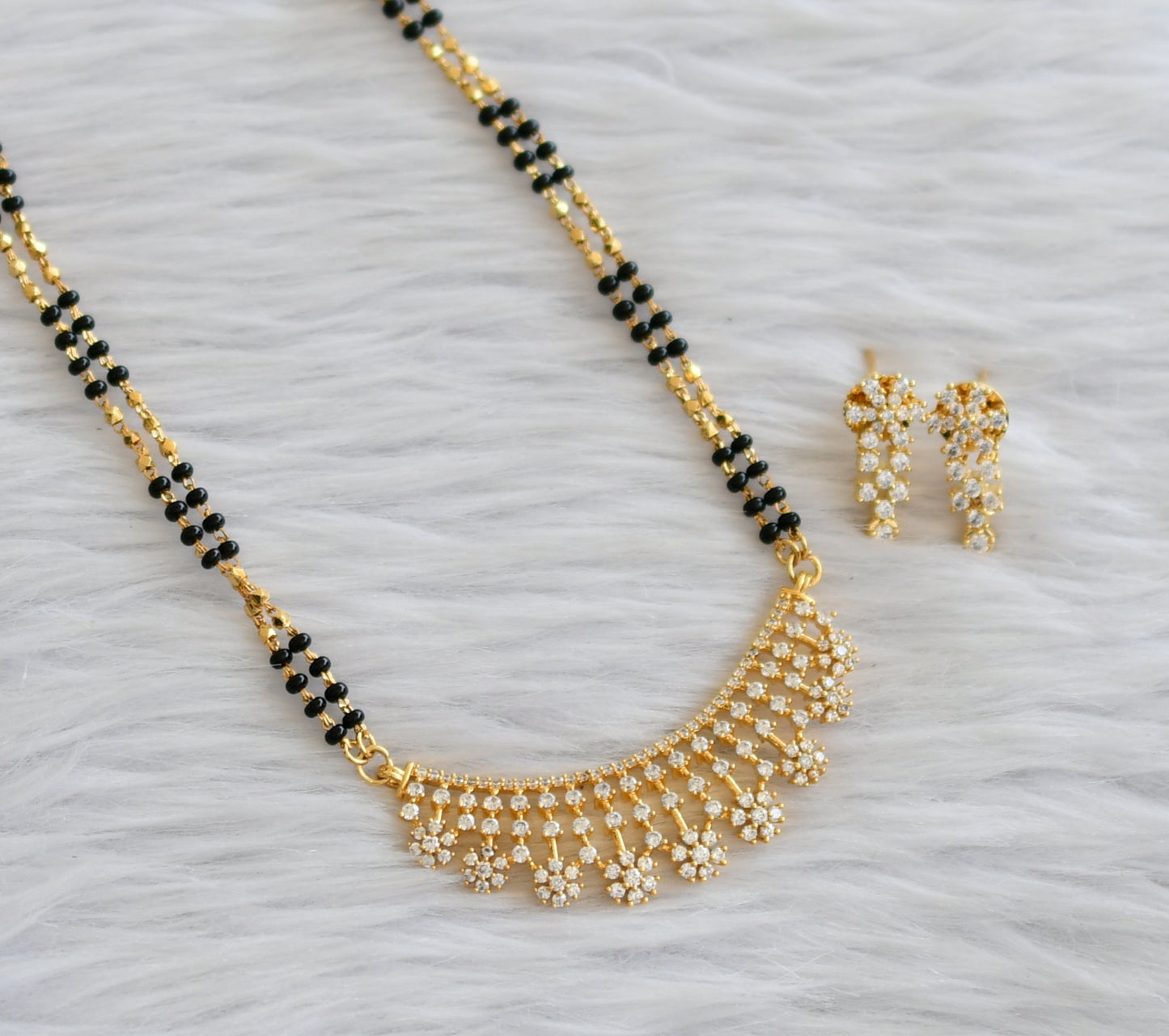 Gold tone 24 inches mangalsutra with cz white flower pendant set dj-45897