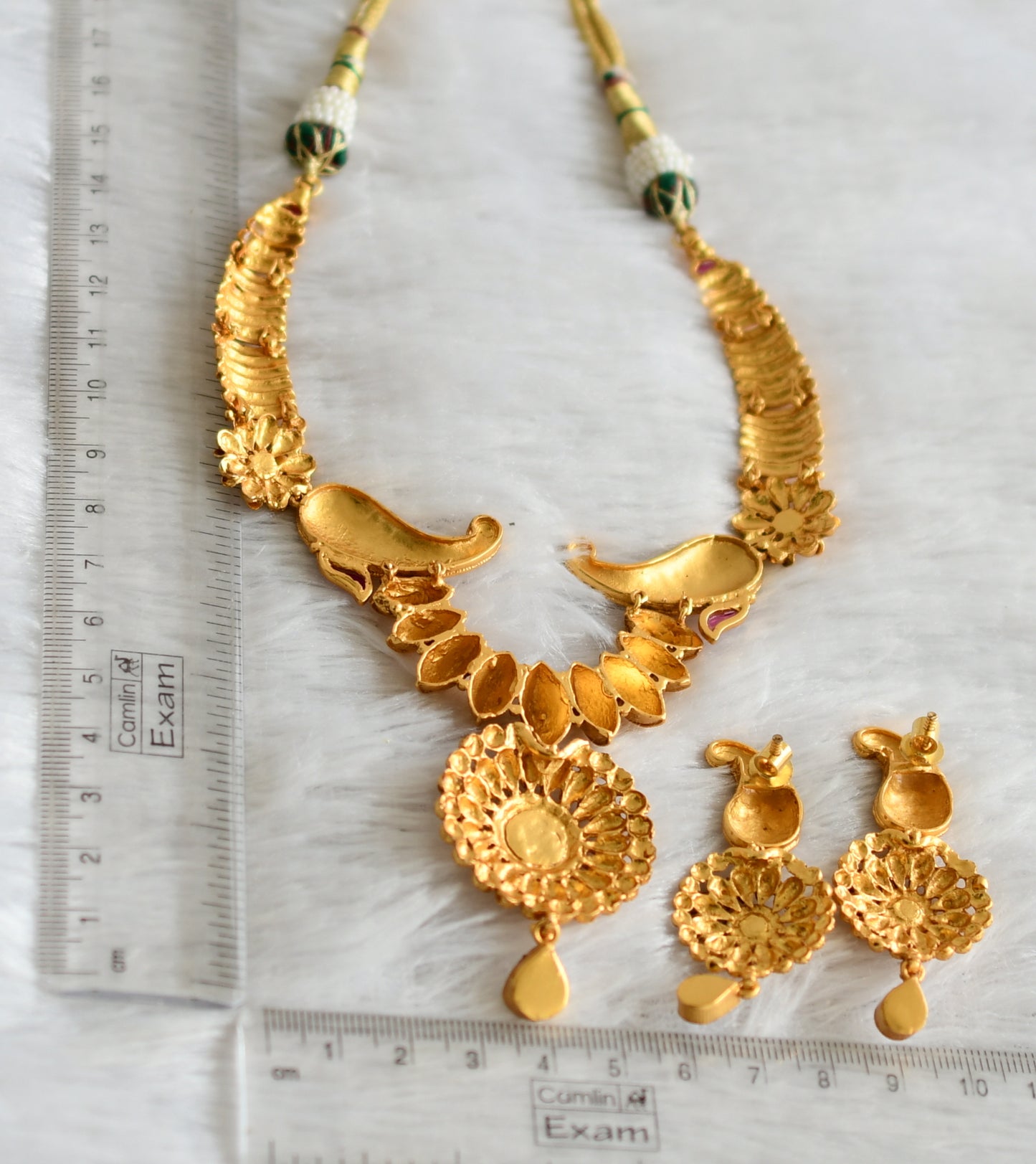 Matte gold tone kemp-white kundan mango necklace set dj-47547