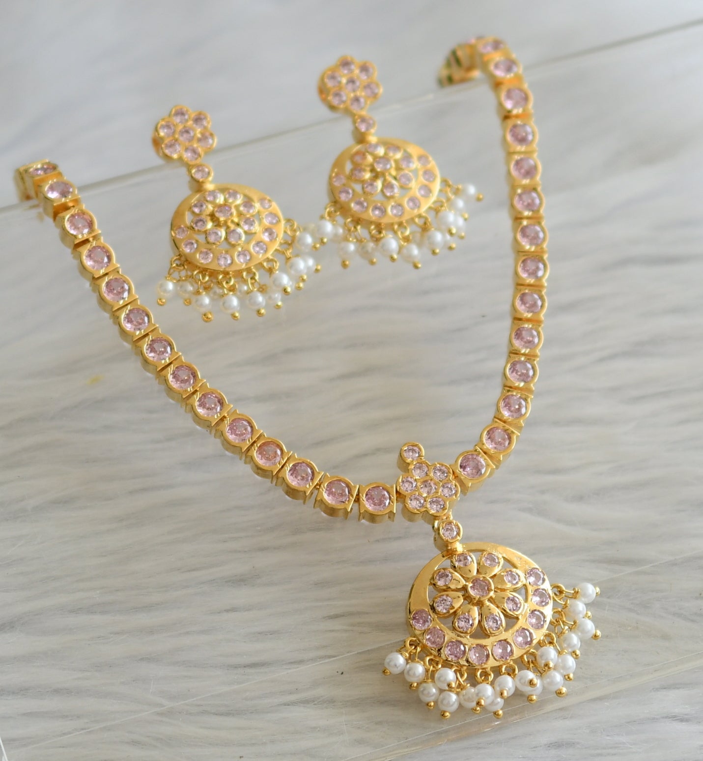 Gold tone ad baby pink south indian style attigai/necklace set dj-45884