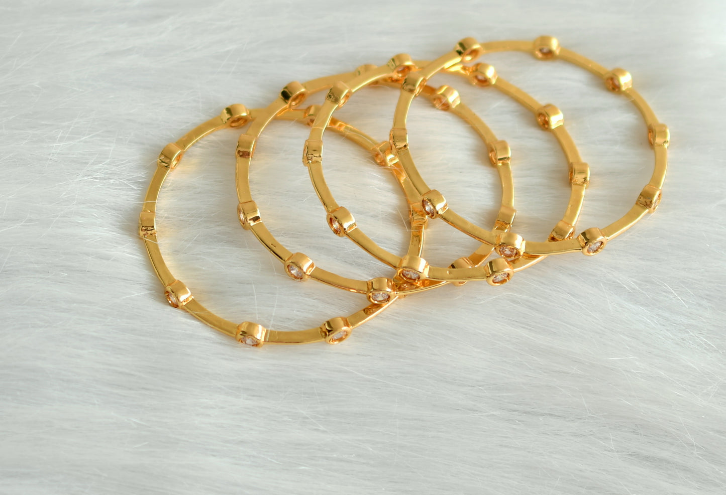Gold tone set of 4 White Bangles (2.4) -dj06687