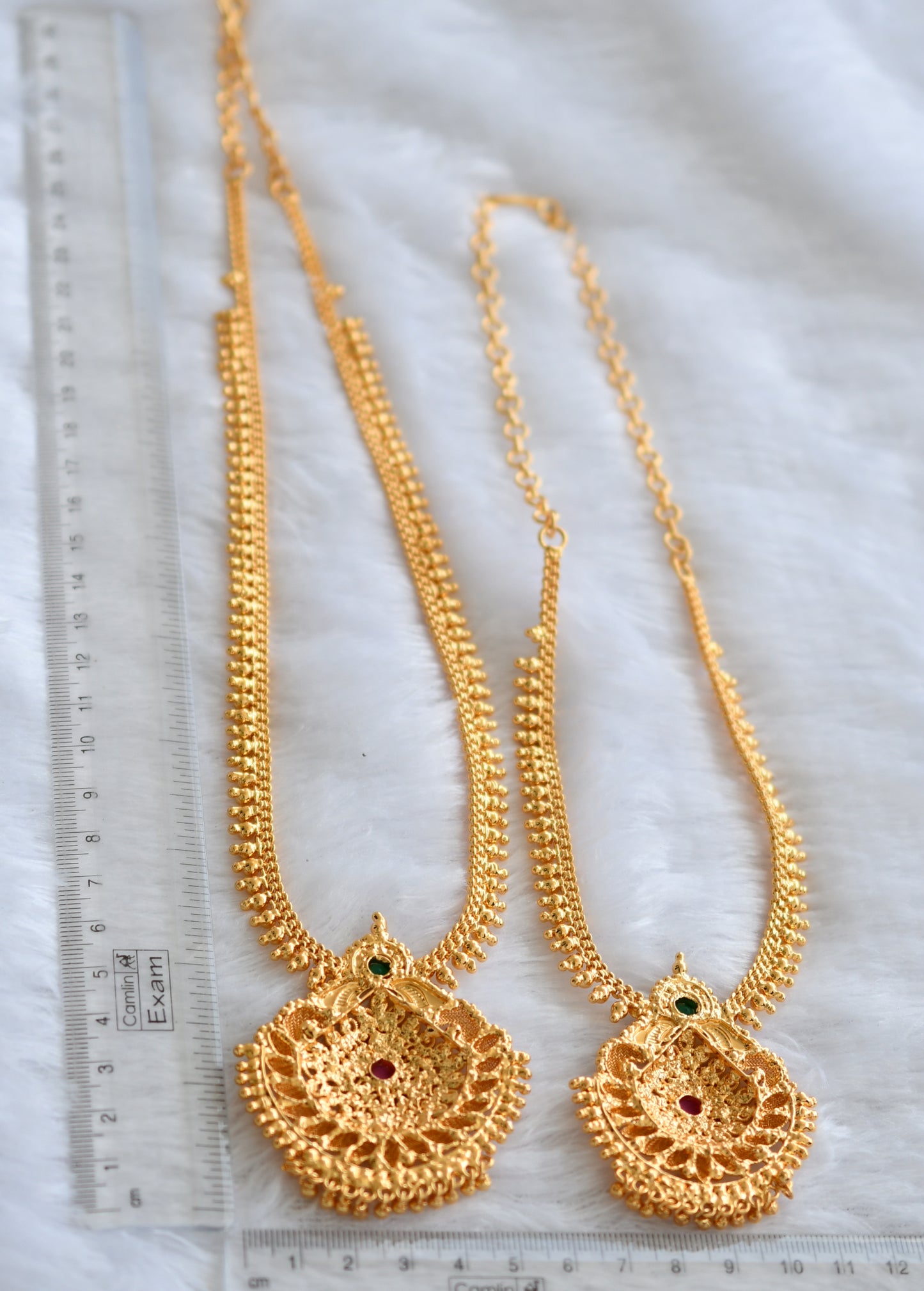 Gold tone ruby-green combo haar set dj-46178