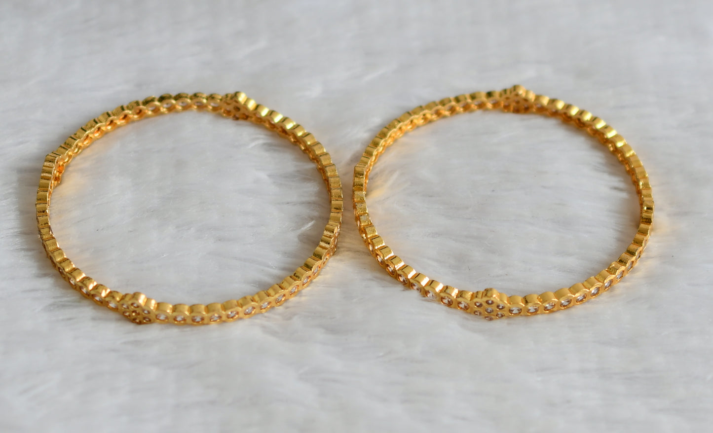 Gold look alike ad white stone floral bangles(2.10) dj-49962