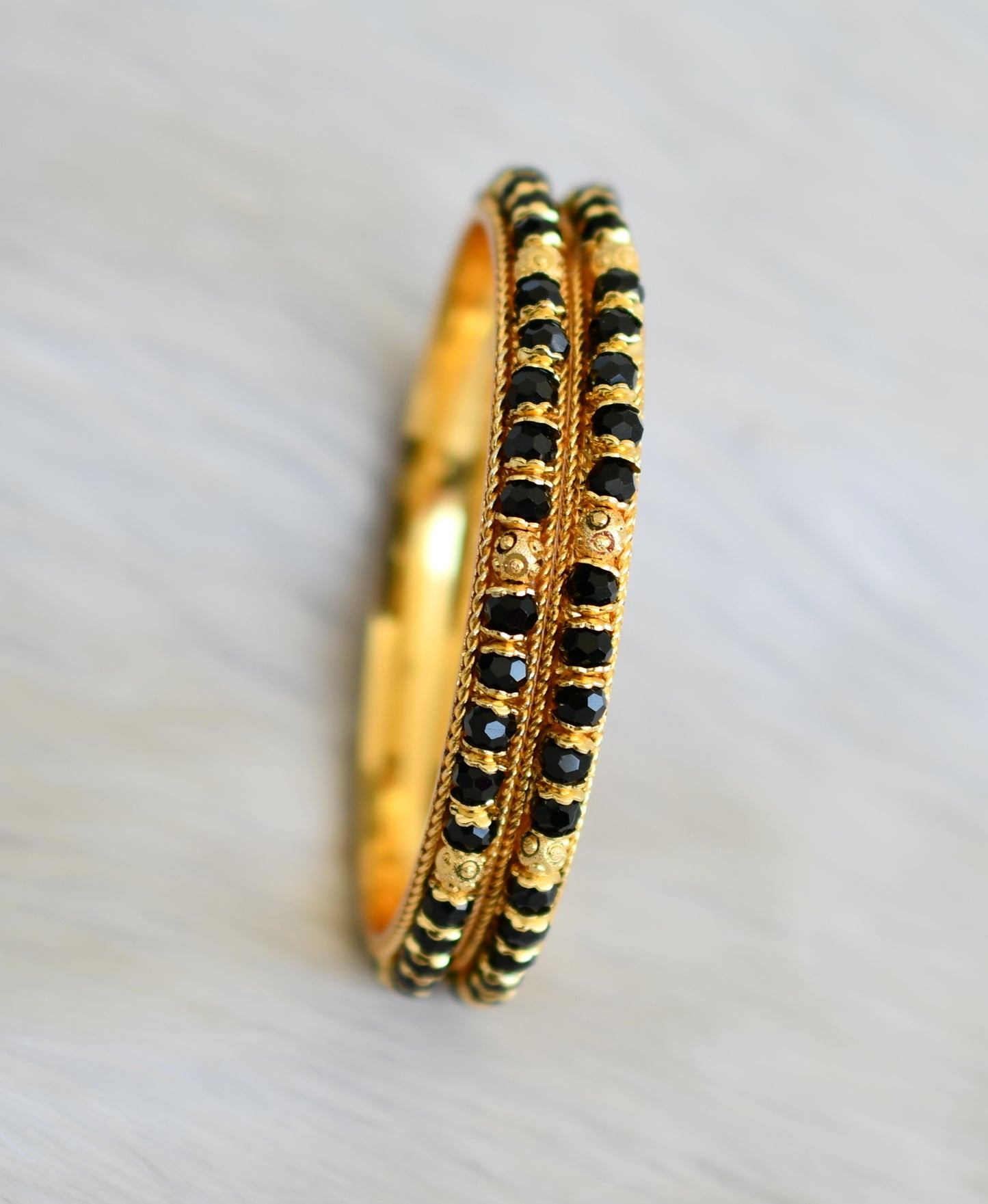 Gold tone black beaded bangles (2.6) dj-41116
