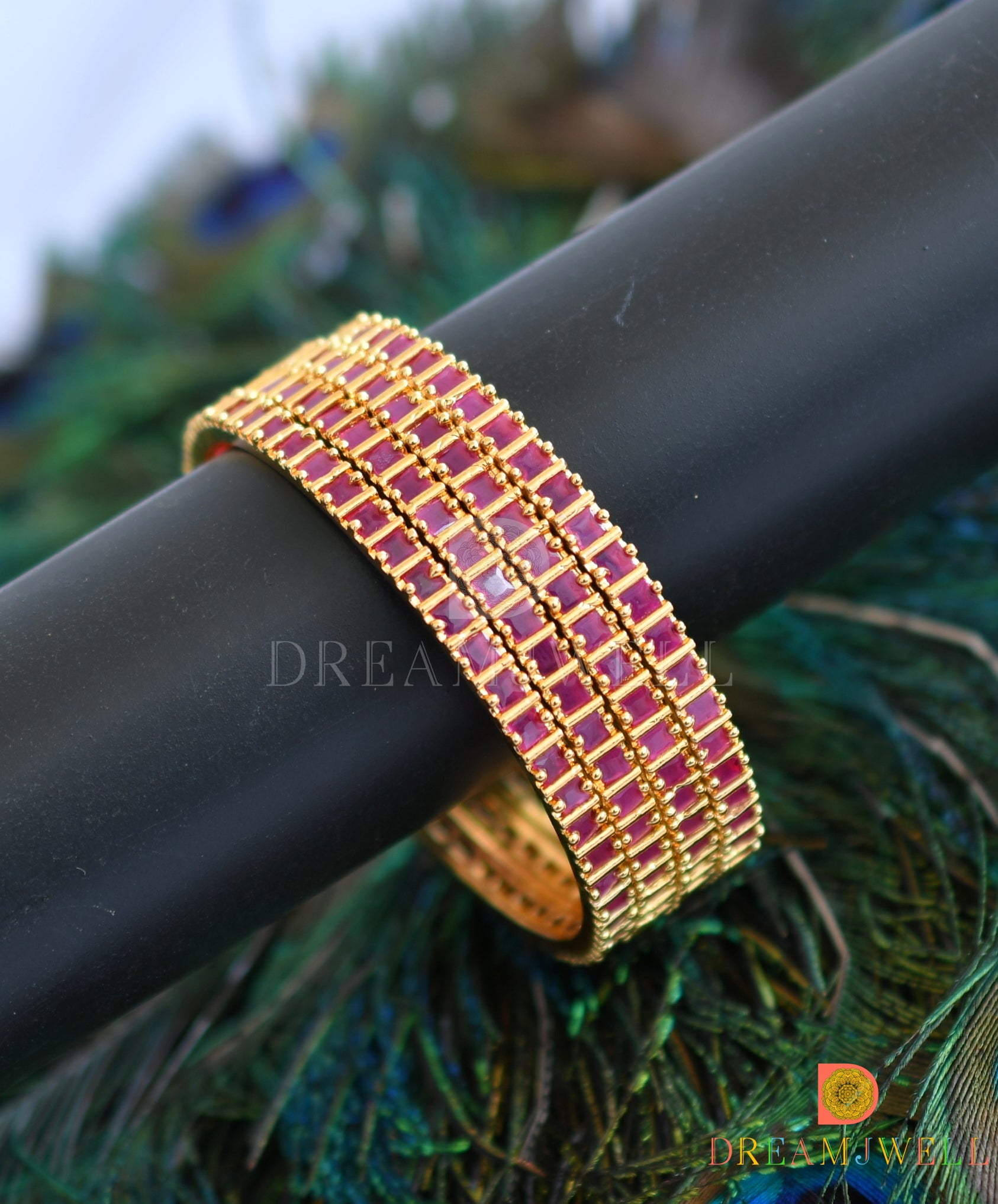 Gold tone set of 4 ruby bangles 2.8 dj 04468