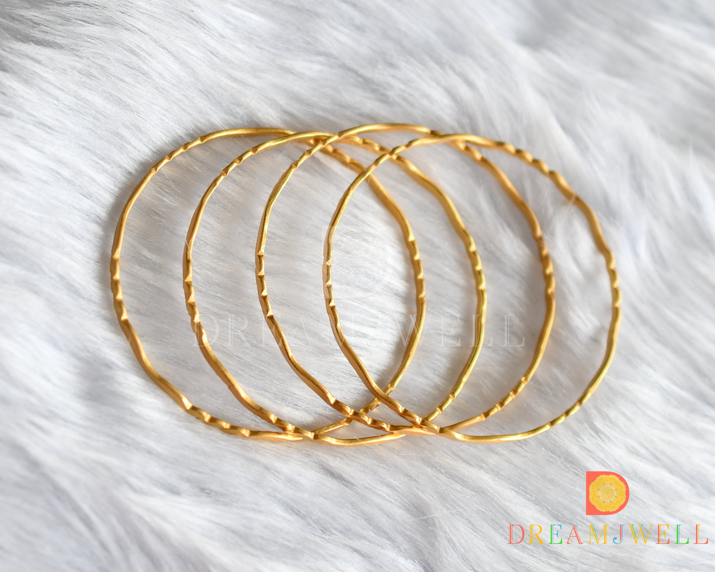 Gold tone set of 4 Bangles (2.8) dj-38253