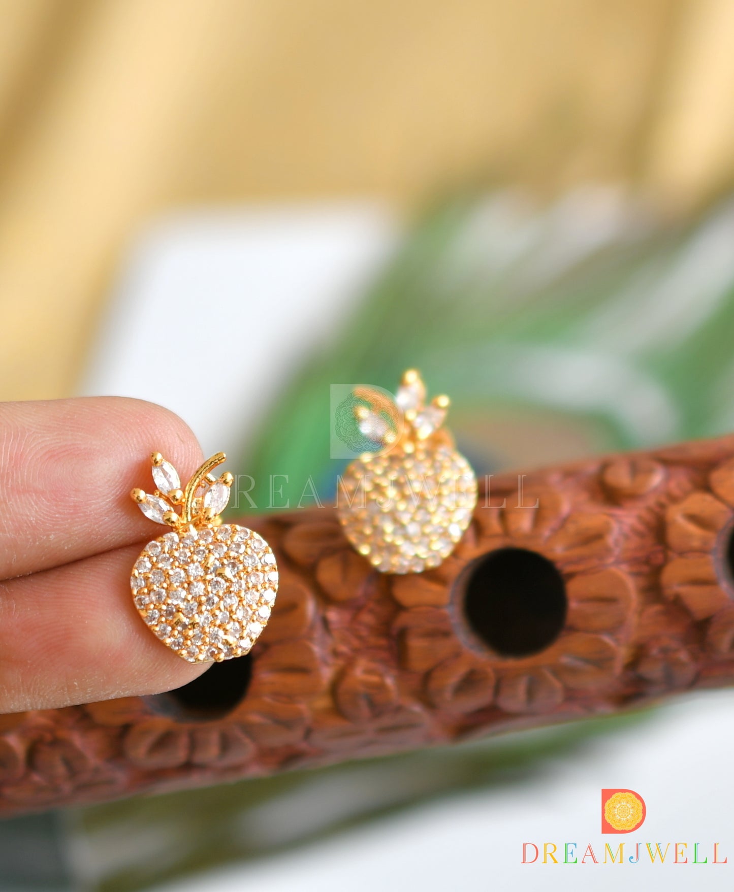 Gold tone cz stone apple earrings