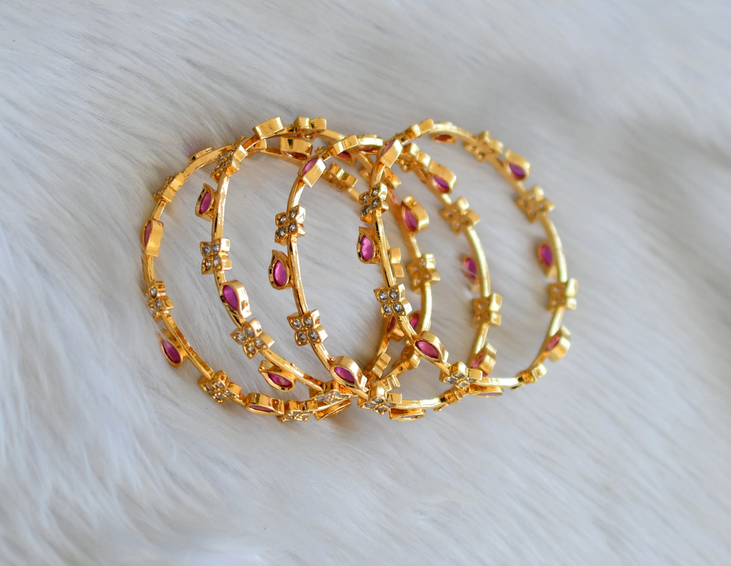 Gold tone ruby-white stone set of 4 Bangles (2.4) dj-40695