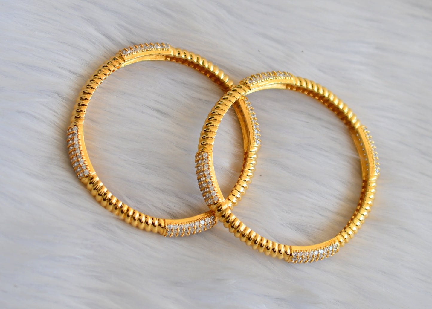Gold tone cz bangles(2.10) dj-29417