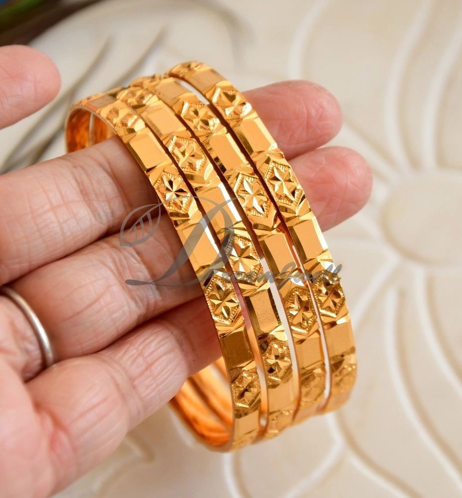 Flower design gold on sale bangles