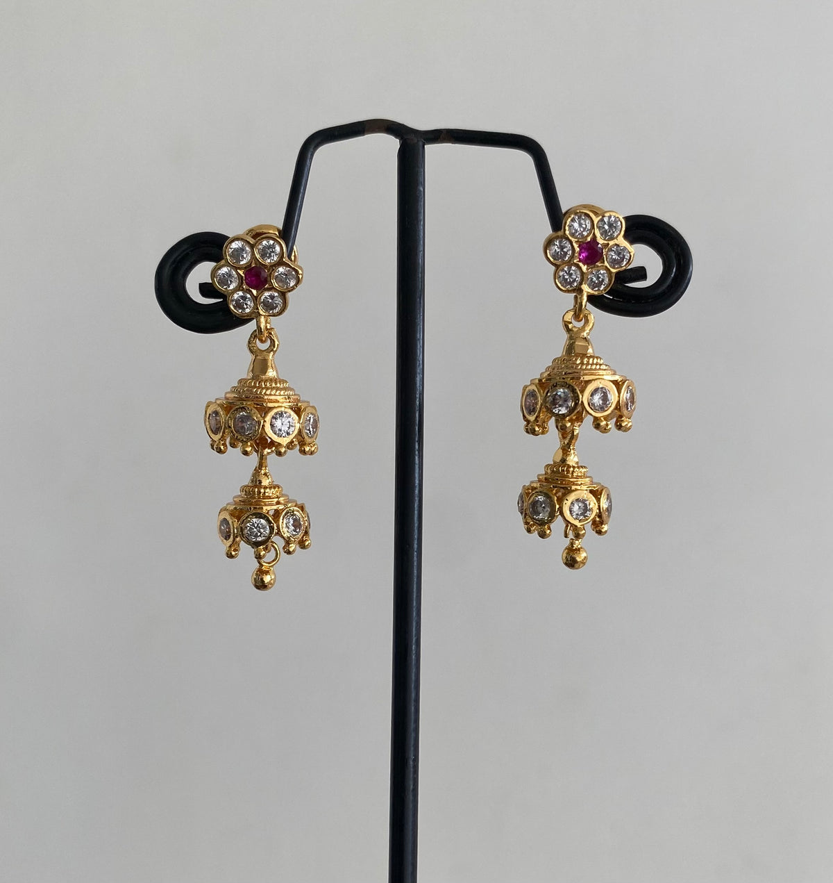 Gold tone ad pink-white stone south indian step jhumkka dj-54894