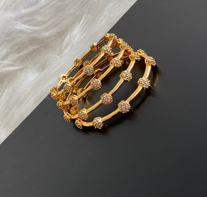 Gold tone white stone set of 4 bangles (2.6) dj-54824