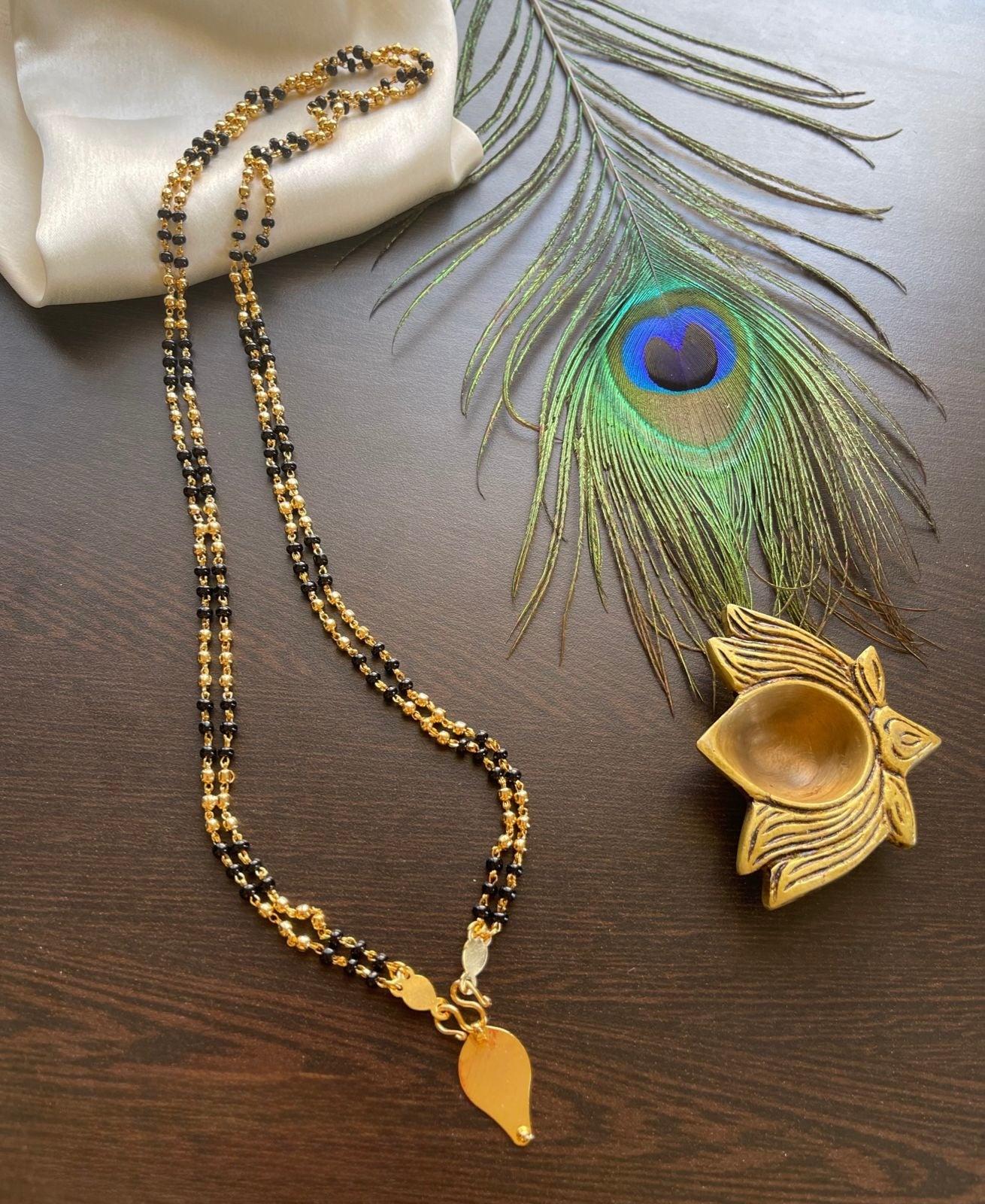 Gold tone black karimani double layer mala with elakka thali pendant dj-35567