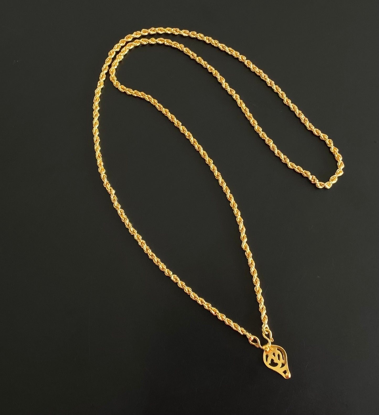 Gold tone 24 inches chain with om elakka pendant dj-54387