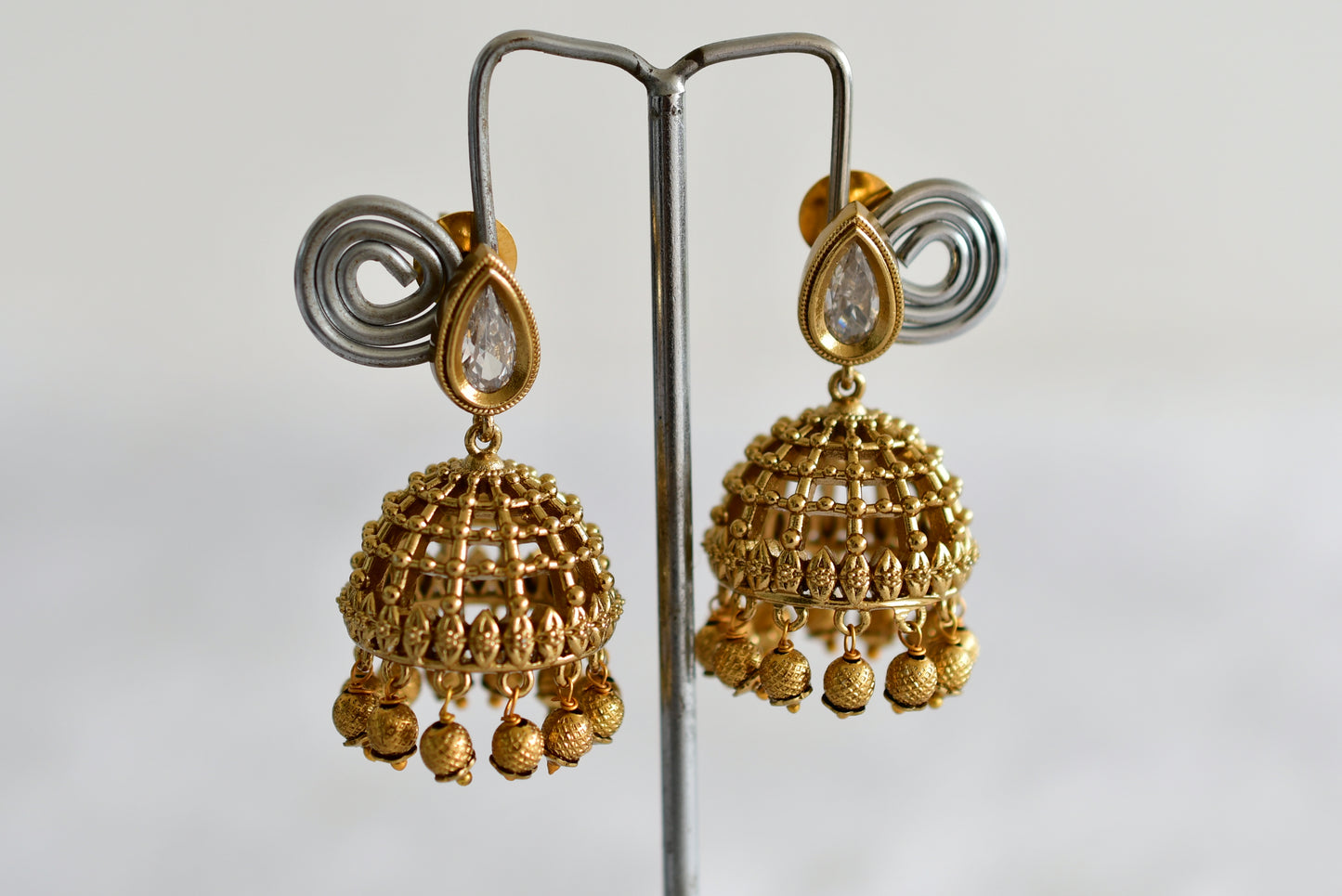 Antique gold tone white thilak stone pearl jhumkka dj-51852