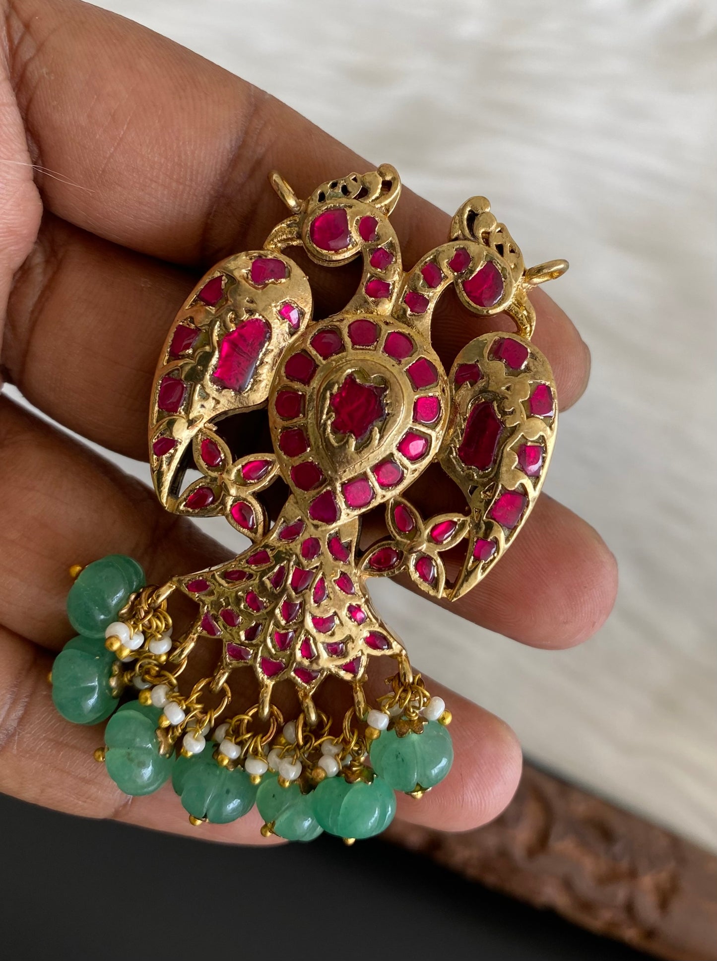 Gold tone pink-green kundan jadau reversible Gandaberunda pendant dj-53842