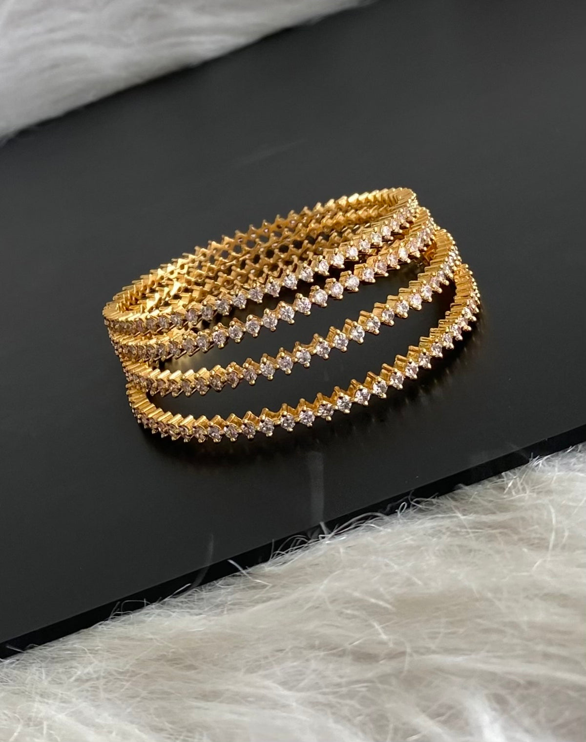Gold tone white stone set of 4 bangles (2.6) dj-54827