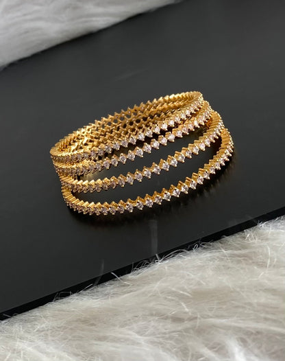 Gold tone white stone set of 4 bangles (2.6) dj-54827