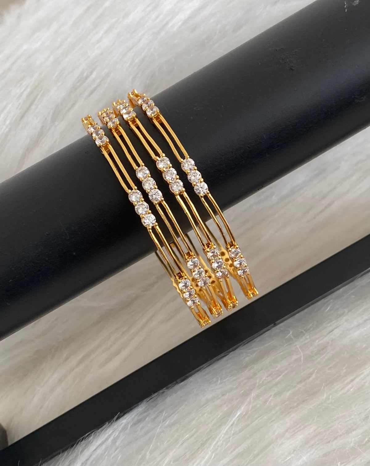 Gold tone white stone set of 4 bangles(2.10) dj-55167