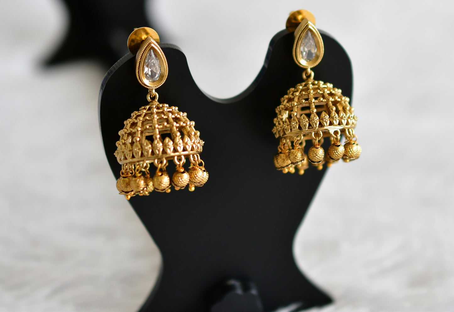 Antique gold tone white thilak stone pearl jhumkka dj-51852
