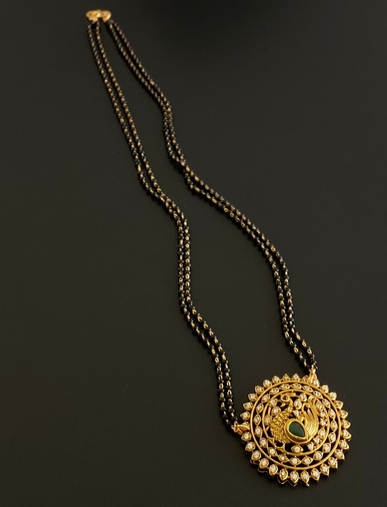 Gold tone 18 inches karimani chain with peacock round pendant dj-53610