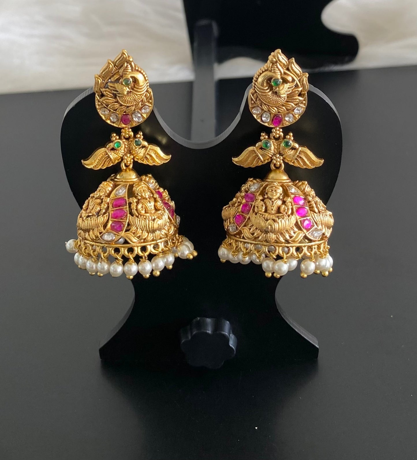 Gold tone pink-green-white stone peacock lakshmi pearl jhumkka dj-54598