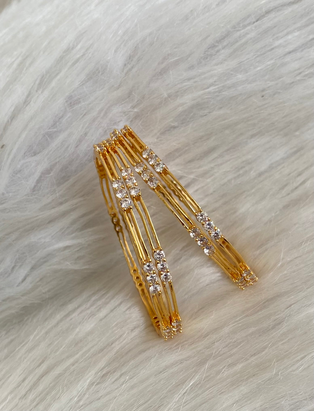 Gold tone white stone set of 4 bangles(2.10) dj-55167