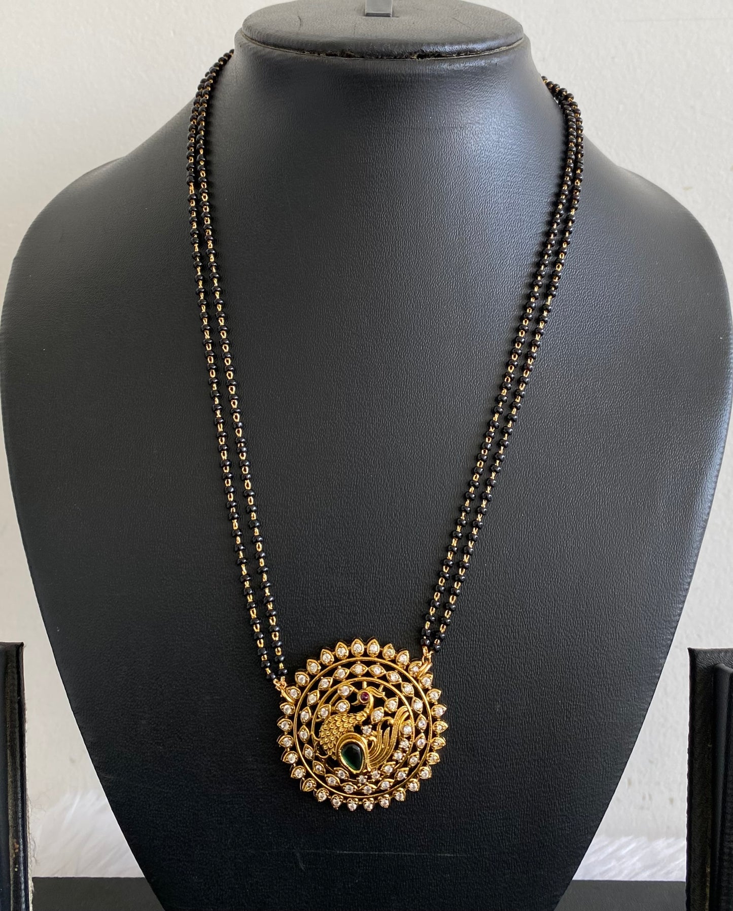 Gold tone 18 inches karimani chain with peacock round pendant dj-53610