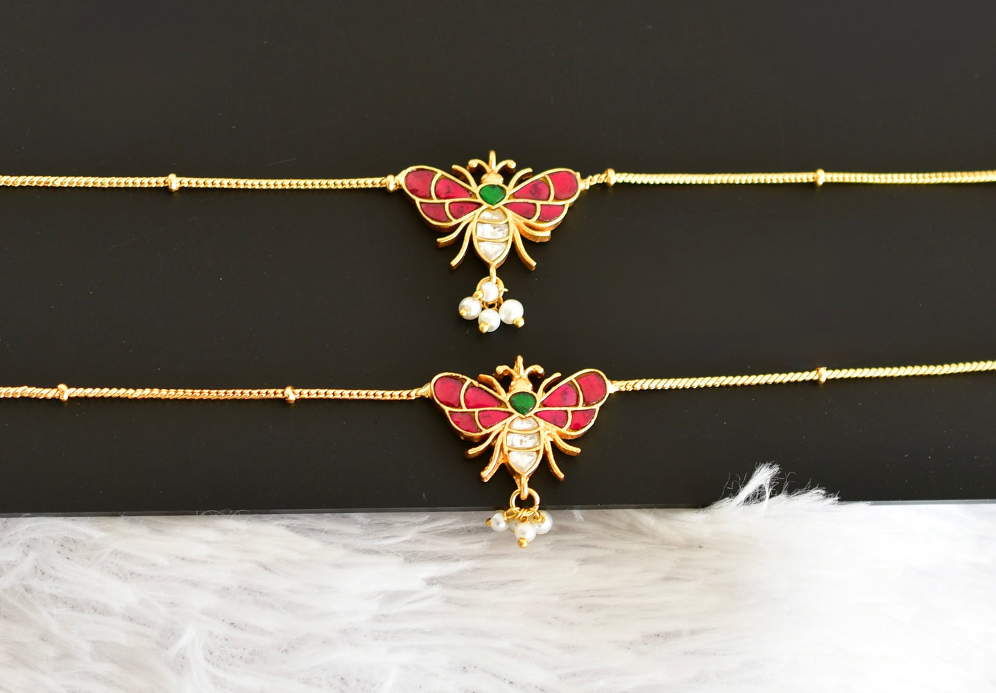 Gold tone pink-green pearl butterfly kundan jadau anklets dj-52387