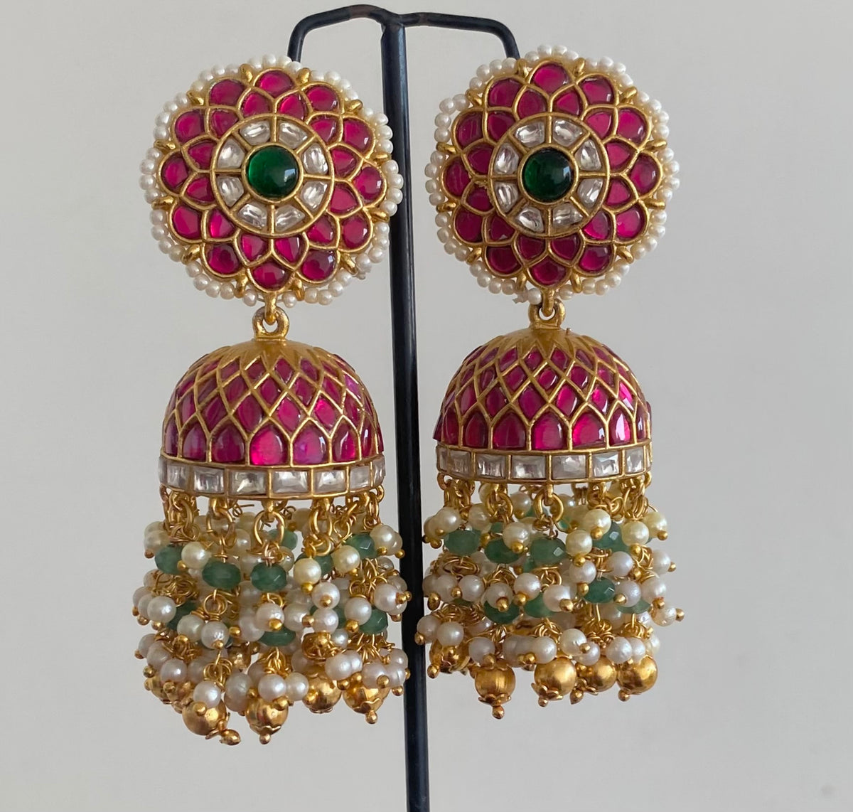 Gold tone pink-white kundan jadau green beaded pearl big jhumkka dj-55100