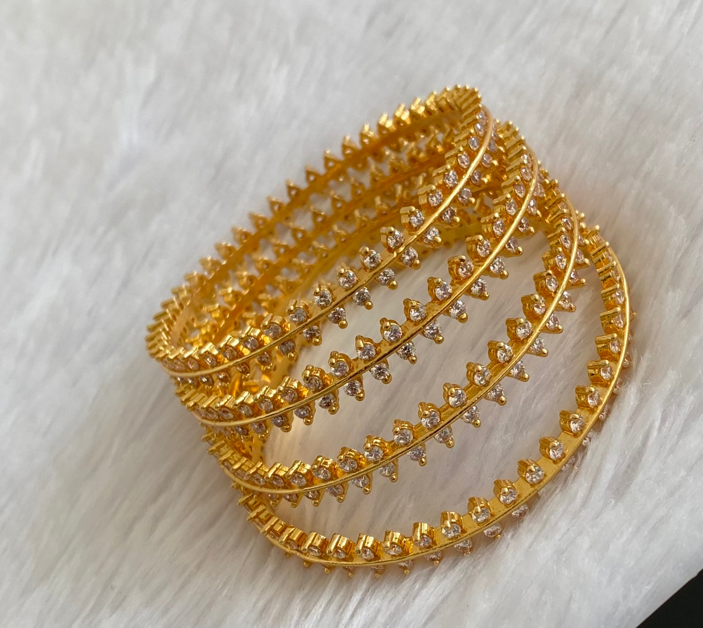 Gold tone white stone set of 4 bangles(2.4) dj-53428