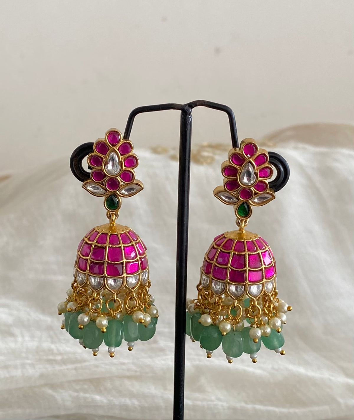 Gold tone pink-white kundan jadau green beaded pearl jhumkka dj-55097