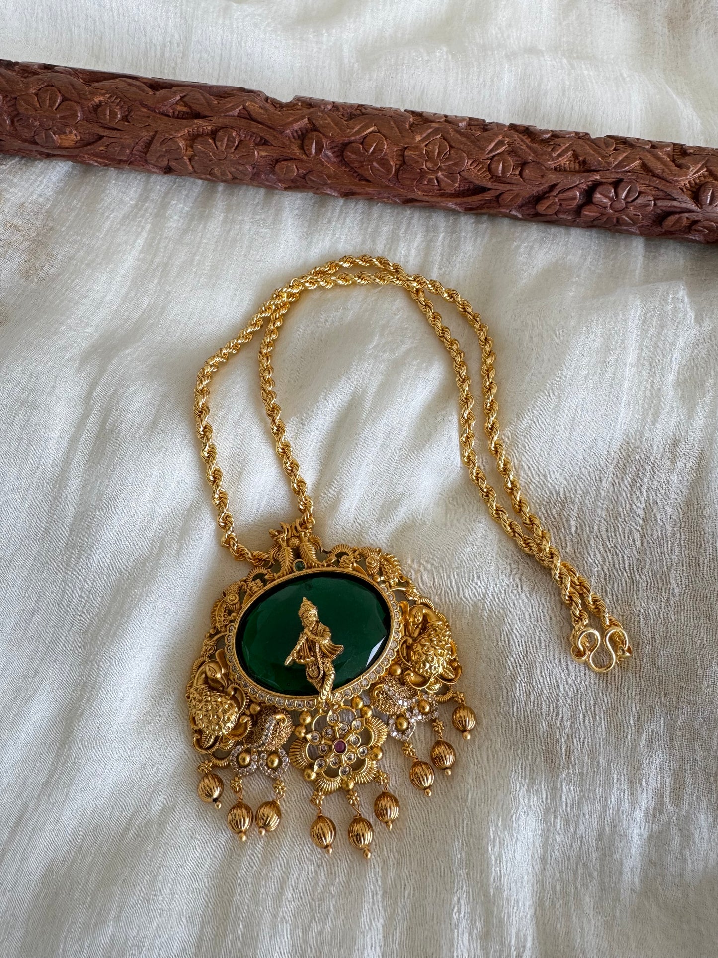 Gold tone 18 inches chain with oval green Krishna pendant dj-52615