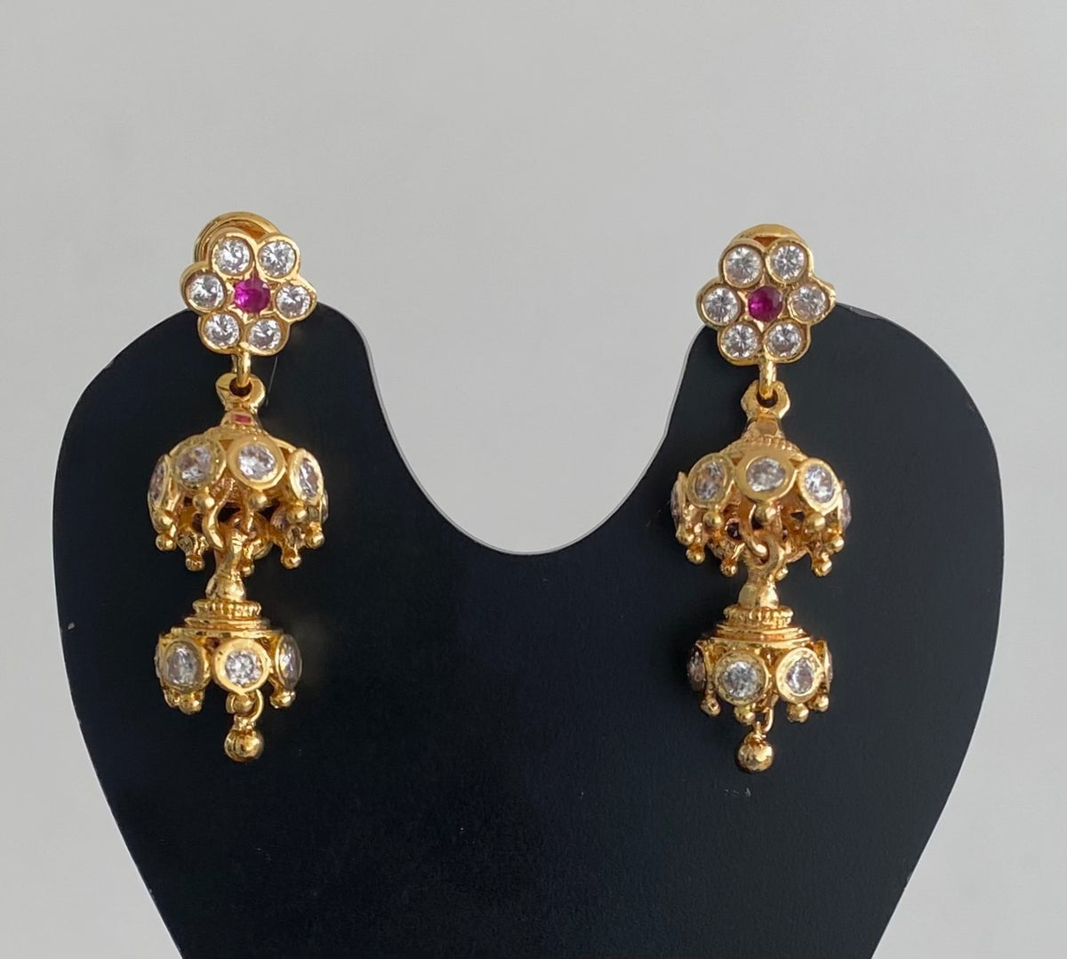 Gold tone ad pink-white stone south indian step jhumkka dj-54894