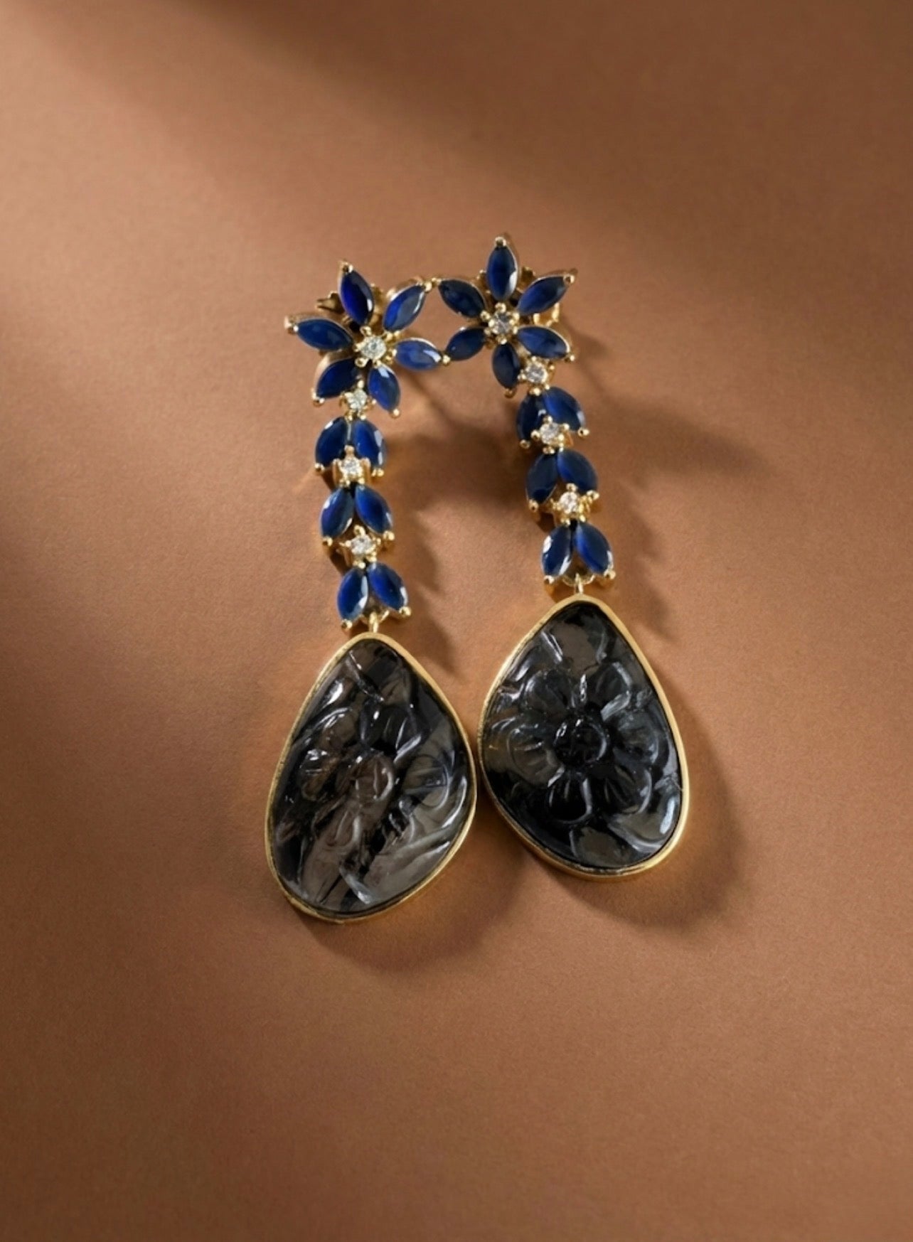 Gold tone blue-black carved stone earrings-dj52589