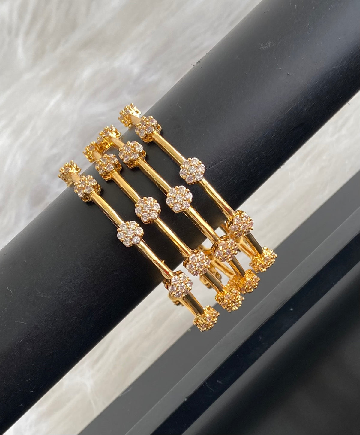 Gold tone white stone set of 4 bangles (2.6) dj-54824