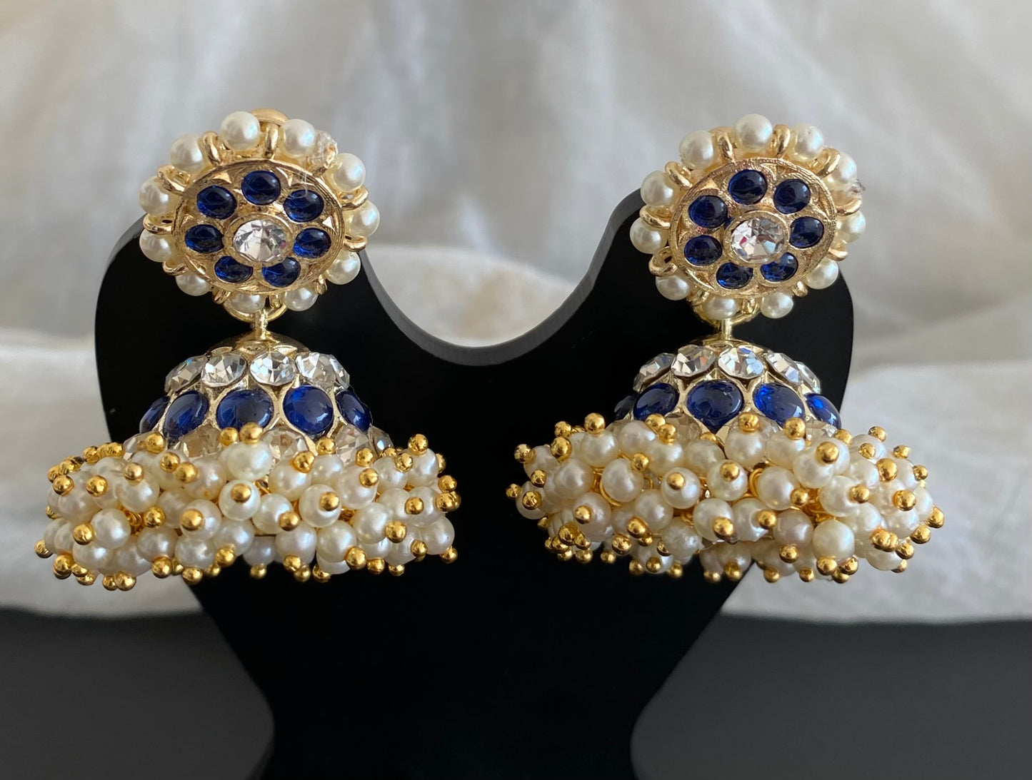 Gold tone precious white-blue stone pearl jhumkka dj-53908