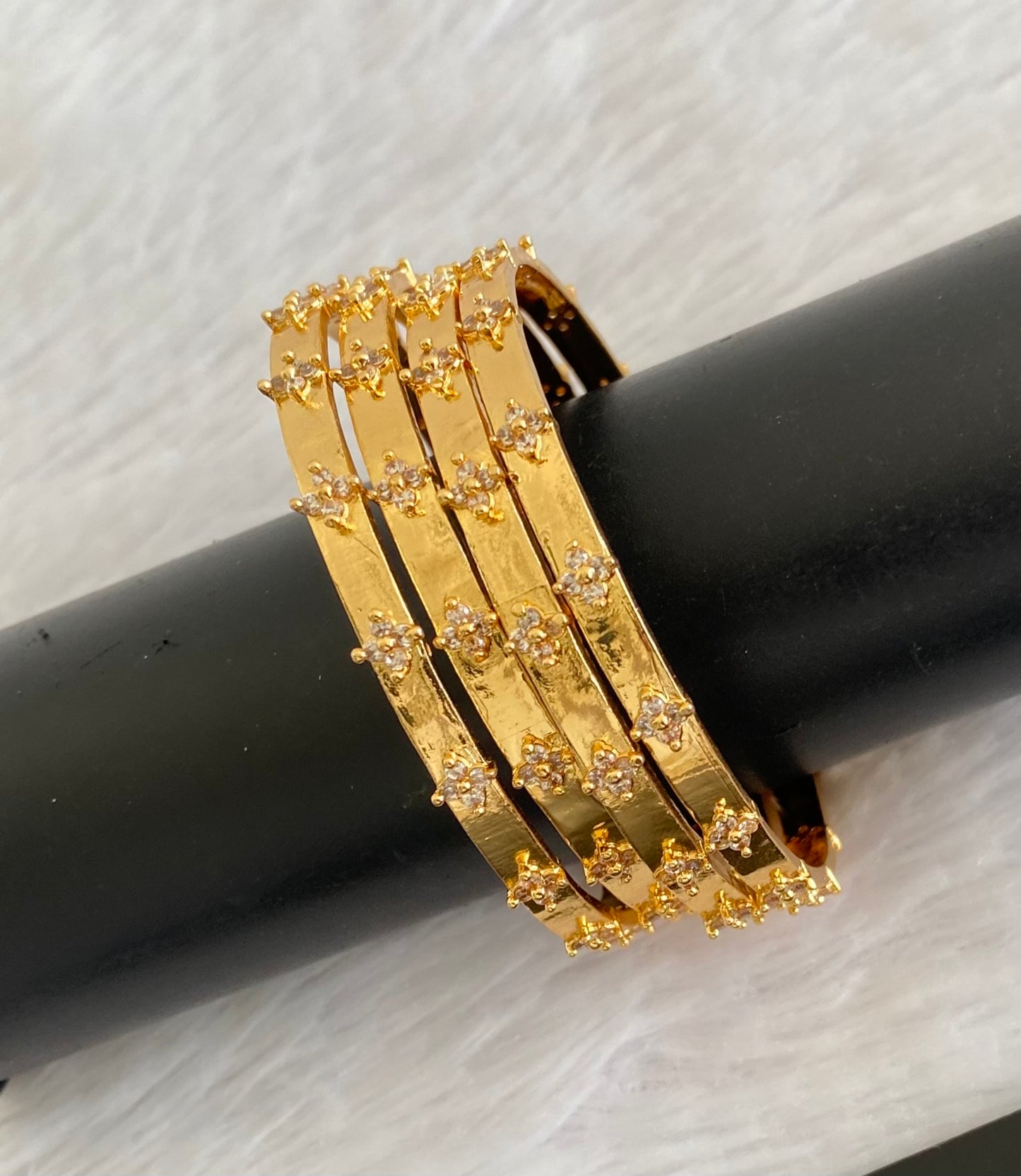 Gold tone white stone set of 4 bangles (2.4) dj-53502