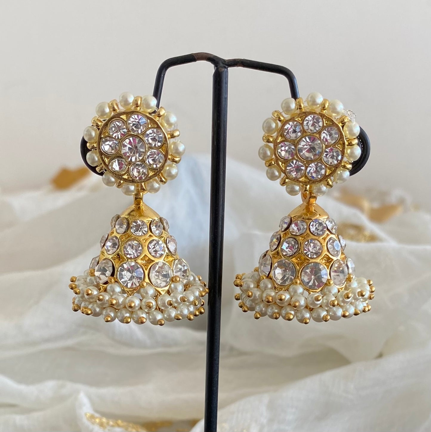 Gold tone precious white stone pearl jhumkka dj-53907