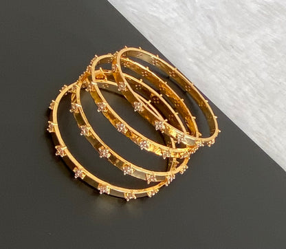 Gold tone white stone set of 4 bangles (2.4) dj-53502