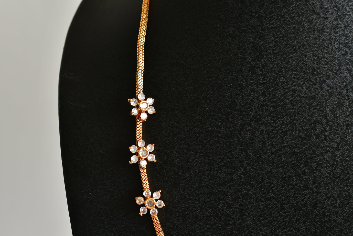 Gold tone white stone flower mugappu chain dj-51899