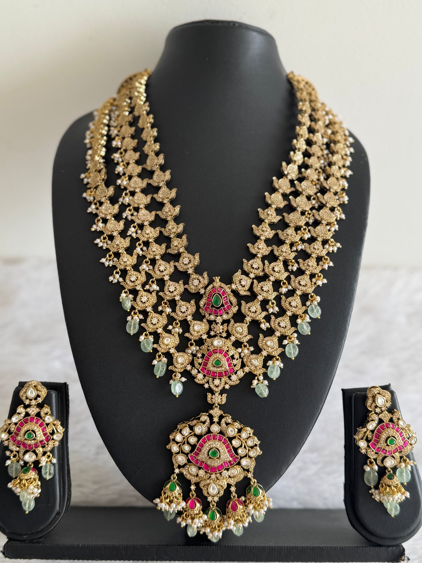 Antique gold tone cz pink-green kundan layer haar set dj-51559