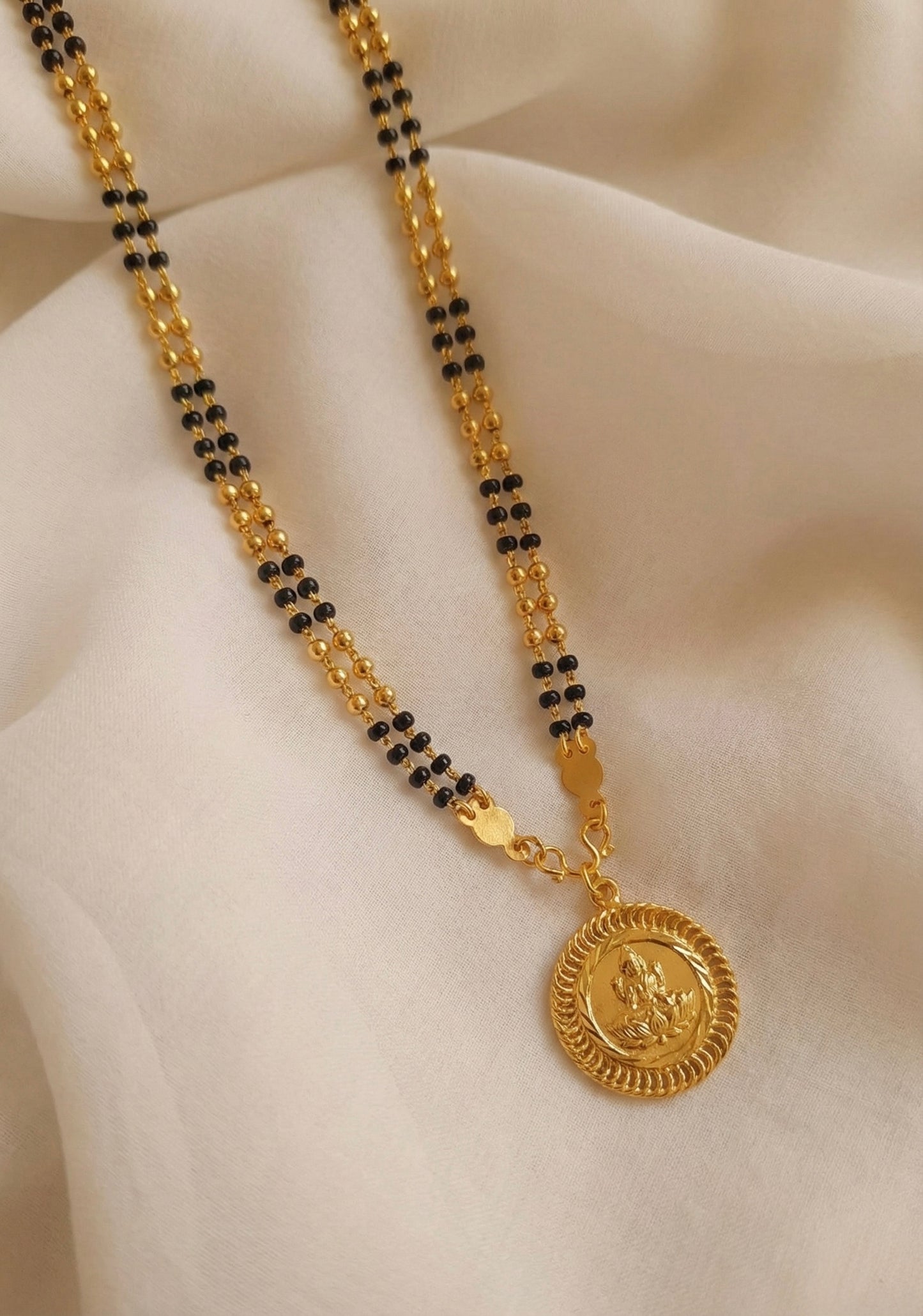Gold tone lakshmi pendant with Karimani chain/mangalsutra dj-35685