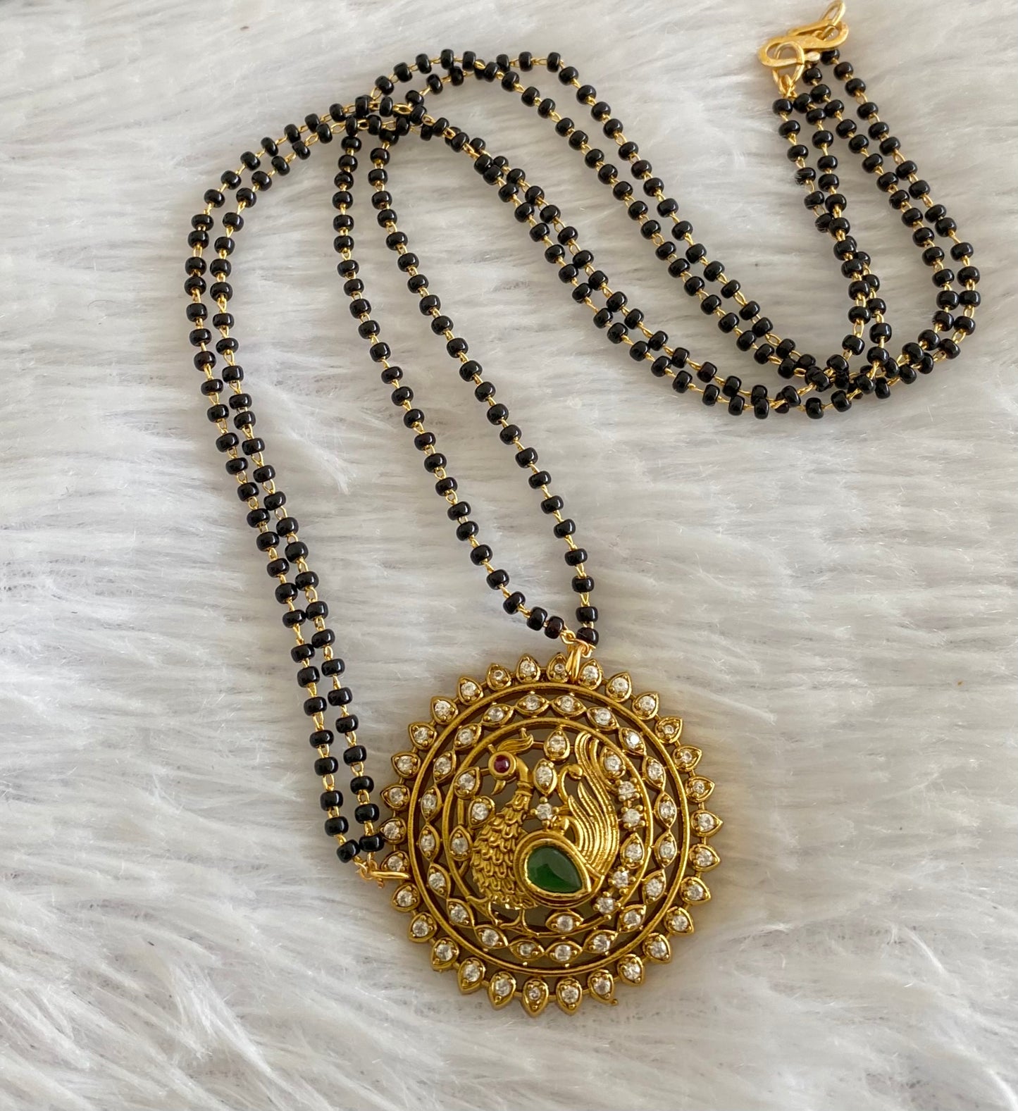 Gold tone 18 inches karimani chain with peacock round pendant dj-53610