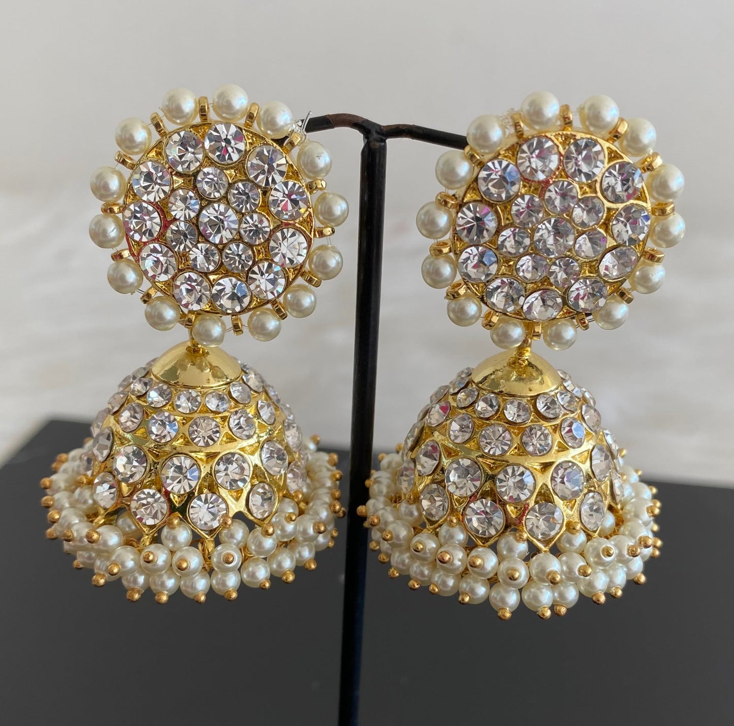 Gold tone precious white stone pearl big jhumkka dj-53906