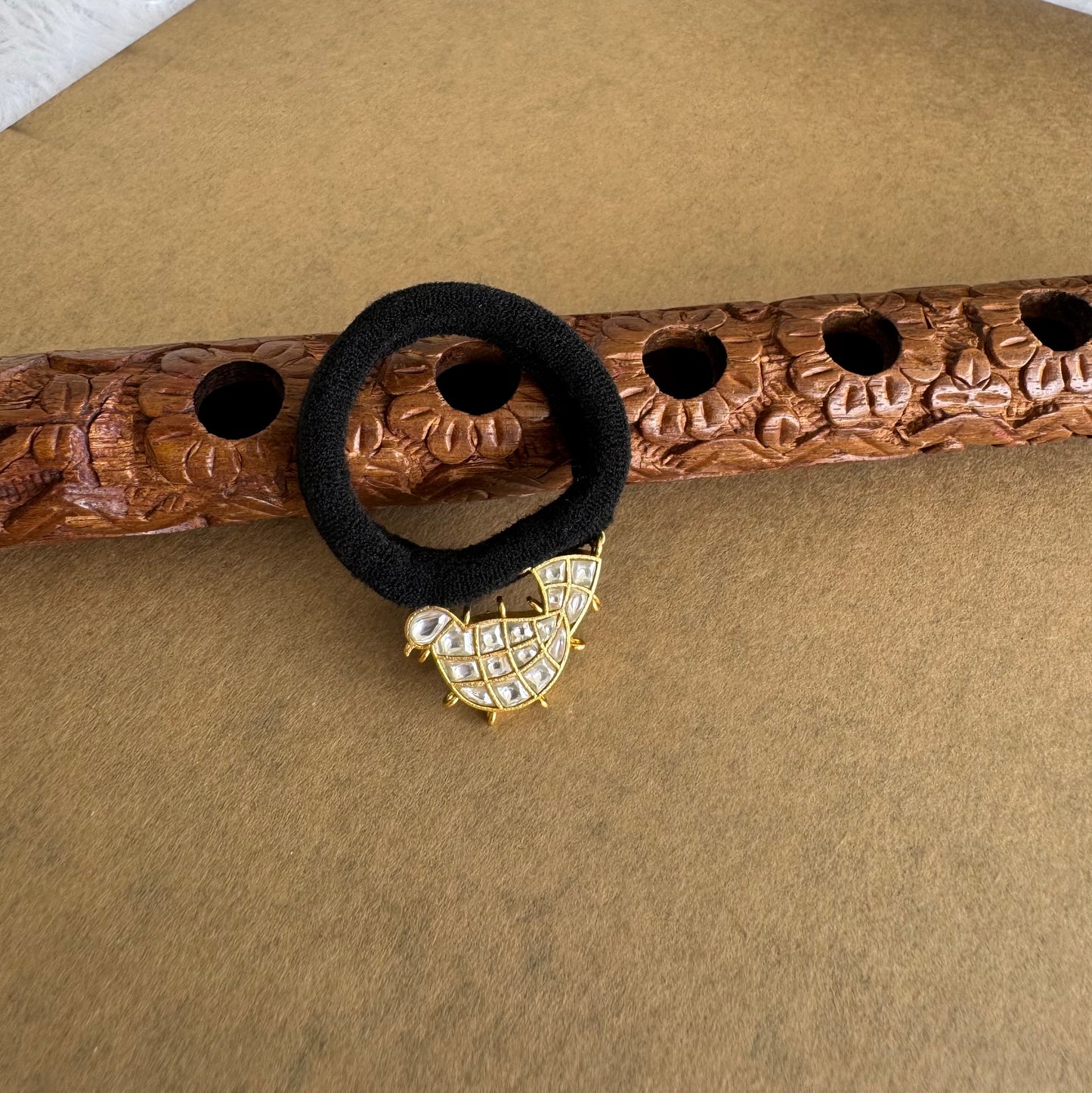 Matte finish white kundan jadau bird hair band dj-51522