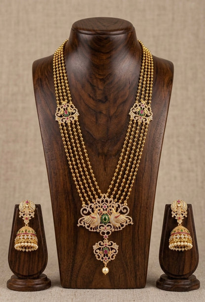 Gold tone cz ruby-green multilayer peacock haar set-dj11499