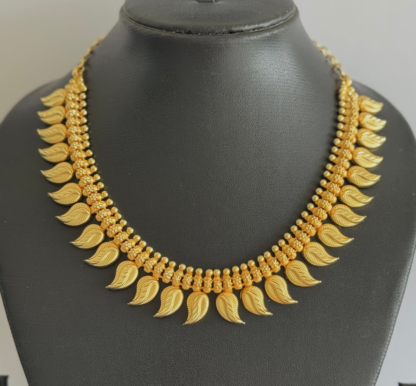 Matte gold tone kerala style mango necklace dj-51653